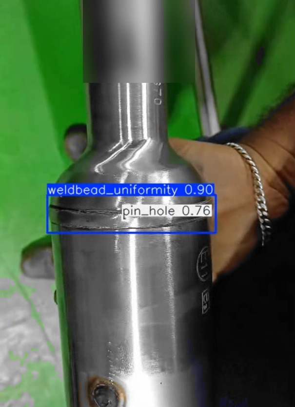 Detection view of a welded component with weld-bead uniformity and pin-hole boxed and confidence-scored