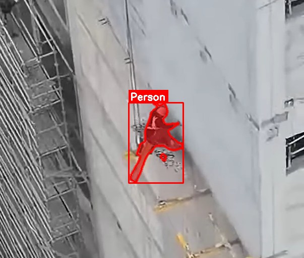Overhead camera detecting a worker at height on rig structure, boxed and labelled PERSON