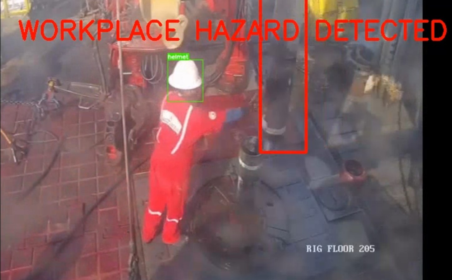 Rig floor camera feed with a WORKPLACE HAZARD DETECTED banner, a worker's helmet boxed and labelled, and the hazard area outlined in red